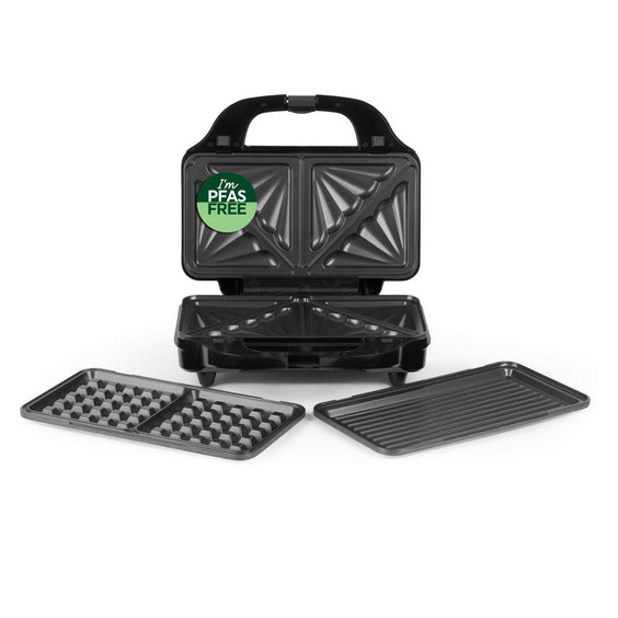Black sandwich maker with interchangeable waffle and grill plates, PFAS free sticker visible