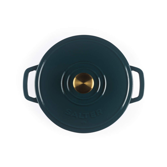 Green cast iron casserole dish with gold knob, top view