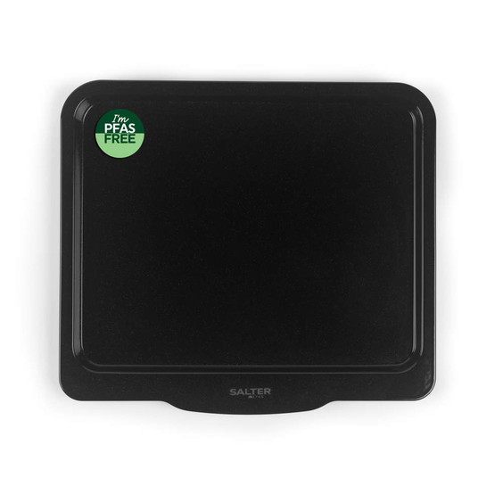 Black non-stick oven tray with PFAS free label, top view
