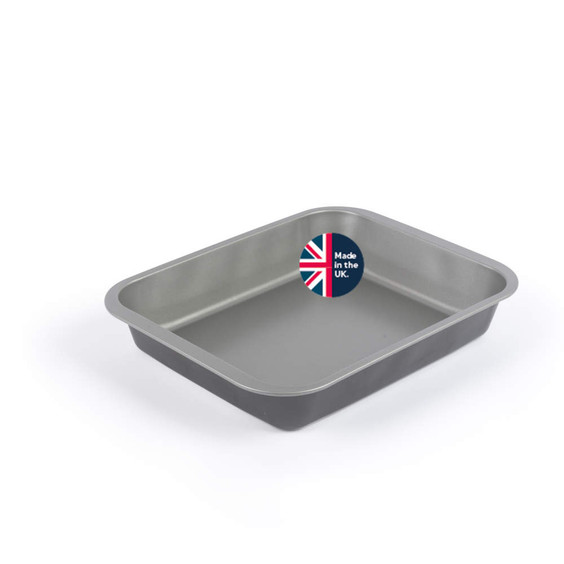 Grey non-stick rectangular roasting tin, viewed at an angle, sticker says made in the UK