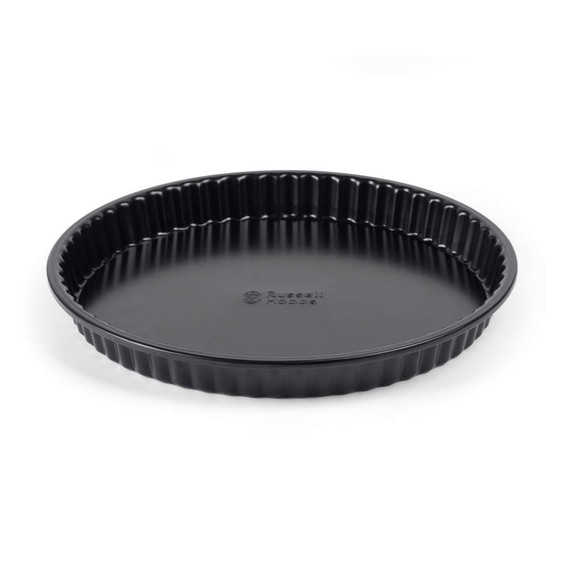 Black fluted non-stick tart tin, viewed angled, suitable for baking quiches or pies