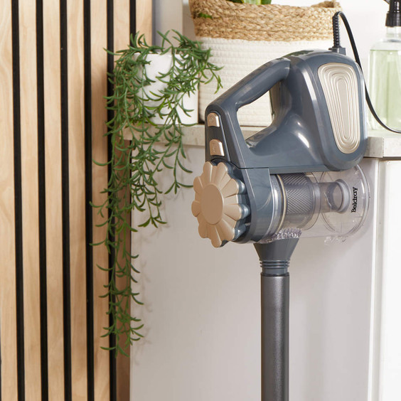 Beldray handheld vacuum cleaner in grey and gold, shown upright on a kitchen worktop.