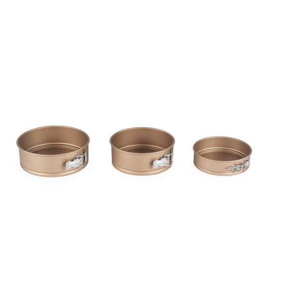 Set of three gold round springform cake tins, shown empty for baking use.