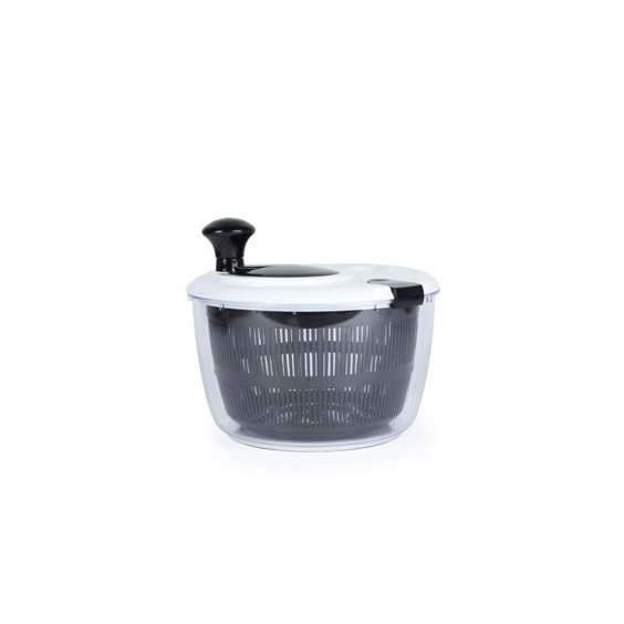 White and black salad spinner with see-through bowl, shown from the side