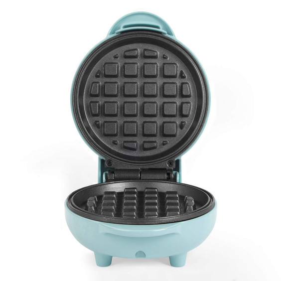 Open mint green mini waffle maker shown from front, empty and ready to use