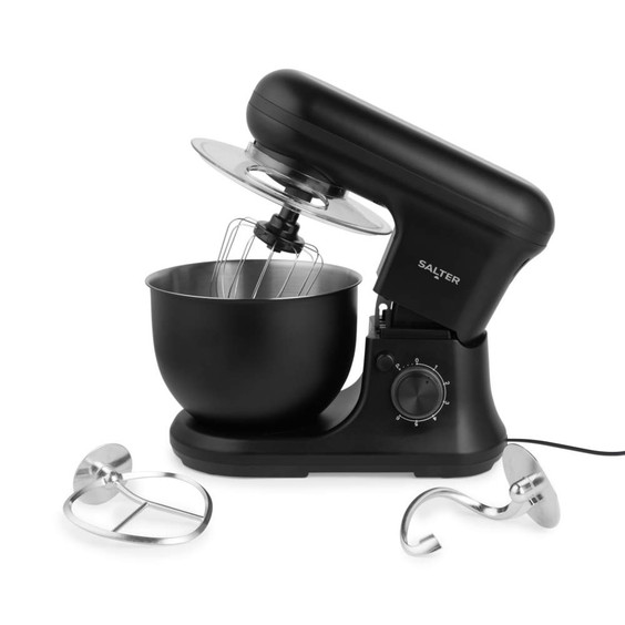 Black stand mixer with stainless steel bowl, whisk attached, and extra beater attachments