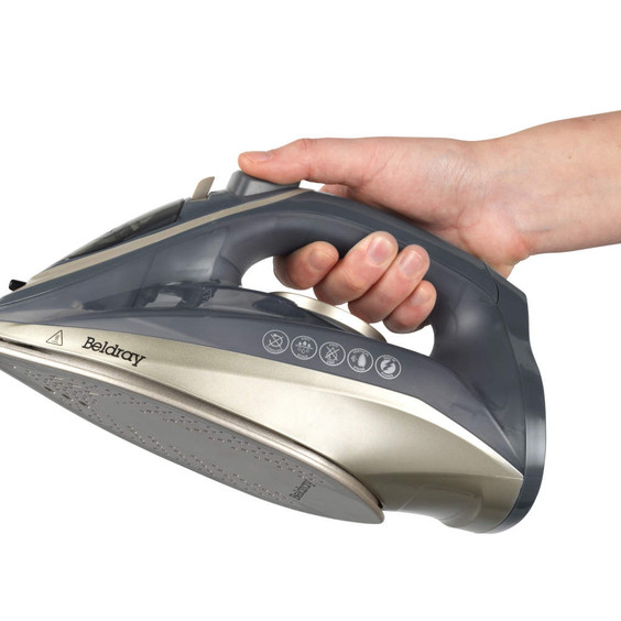 Beldray gold and grey steam iron held in a hand, side view