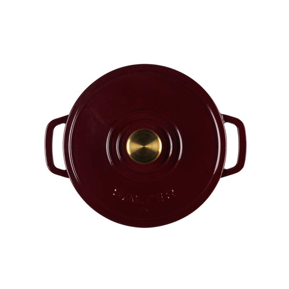 Red cast iron casserole dish with gold knob, seen from above