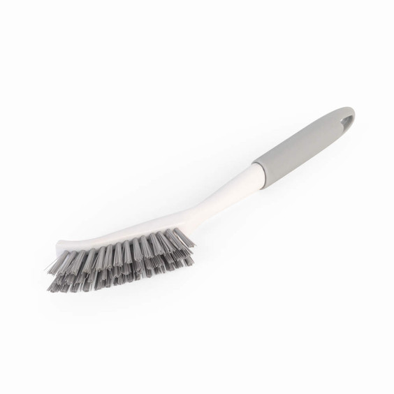 Grey and white cleaning brush with angled bristles and soft grip handle