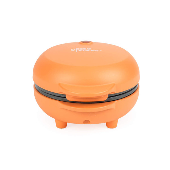 Orange mini waffle maker with closed lid, shown from the front.