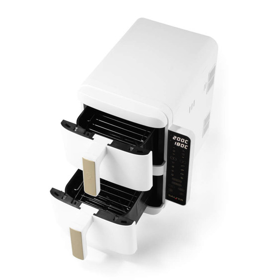 White dual drawer air fryer with digital touch controls and gold handles, shown empty