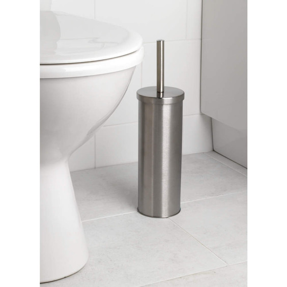 Silver stainless steel toilet brush holder in bathroom next to toilet