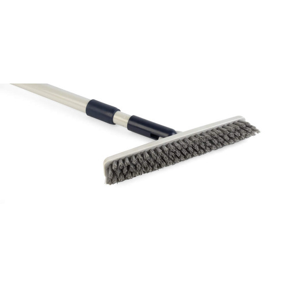 Grey stiff bristle broom with long handle for outdoor sweeping