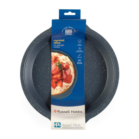 Round black non-stick baking pan with speckled finish, in Russell Hobbs retail packaging.