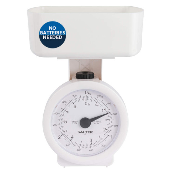 White mechanical kitchen scale with bowl, marked 'No batteries needed'