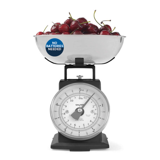 Mechanical kitchen scale with bowl of cherries, 'No batteries needed' label