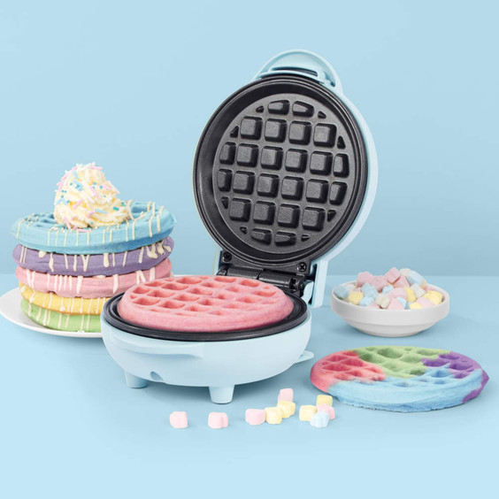 Pastel blue waffle maker with colourful waffles, styled for product listing.