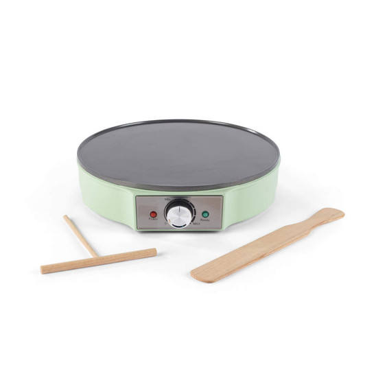 Electric crepe maker in pastel green with temperature dial and two wooden utensils