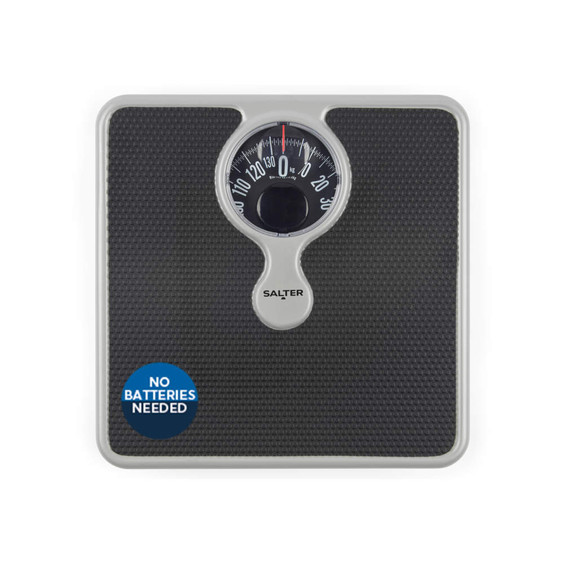 Mechanical black bathroom scale with textured surface, dial display, no batteries needed