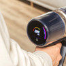 Close-up of cordless vacuum cleaner display screen showing power mode indicator