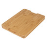 Rectangular bamboo chopping board with groove, shown from a side angle