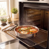 Silver oven tray with cooked eggs and vegetables, shown on open oven rack.