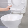Hand removing white toilet seat for easy cleaning on wall-mounted toilet