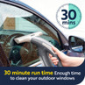 Handheld window vacuum cleaning car window with 30 minute run time shown.