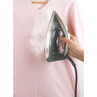 Steam iron in use on light pink shirt, showing steam function