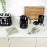 Black Salter kettle and toaster on kitchen counter with tea and mug