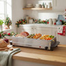 Buffet server with roast meats, potatoes and vegetables in festive kitchen setting