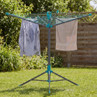 Rotary washing line with shirt and towel hanging, shown in a sunny garden