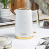 White and gold electric kettle on kitchen worktop, modern ribbed design