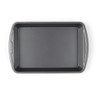 Large grey non-stick roasting tray with side handles, shown from above