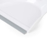 White plastic dustpan with grey rubber edge, close-up of front rim.