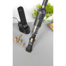 Cordless handheld vacuum cleaner with charging dock, cleaning crumbs on worktop