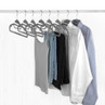 Wardrobe rail with assorted clothes on grey felt hangers, including shirts and trousers