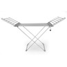 Silver heated clothes airer with fold-out wings and plug, shown upright.