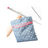Blue star print peg bag with pink trim, shown hanging on rotary clothesline.