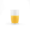 Clear measuring jug half-filled with orange liquid, shown on white background