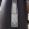 Close-up of black kettle water level indicator showing measurements from 0.5L to 1.7L