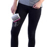 Pet hair remover roller in use on black jeans