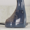 Close-up of dark grey handheld garment steamer base on countertop