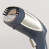 Handheld clothes steamer with brush attachment in grey and silver