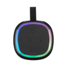 Black portable Bluetooth speaker with rainbow LED light trim, top view