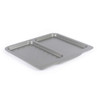 Grey non-stick oven tray with ribbed and flat sections, shown angled on white background