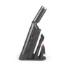 Cordless handheld vacuum cleaner in silver, side view on charging base with attachments