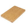 Rectangular bamboo chopping board with groove, shown at angle.
