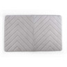 Light grey chevron pattern bath mat, rectangular, shown flat from above