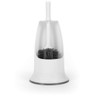 Black silicone toilet brush cleaning white ceramic toilet bowl